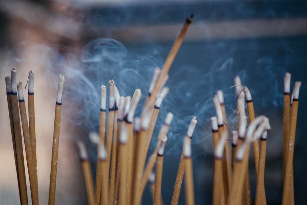 multiple incense sticks | Photo by Milada Vigerova